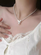 Pearl butterfly pendant necklace featuring a delicate pearl and butterfly charm on a silver chain, stylish jewelry by Shopimist.