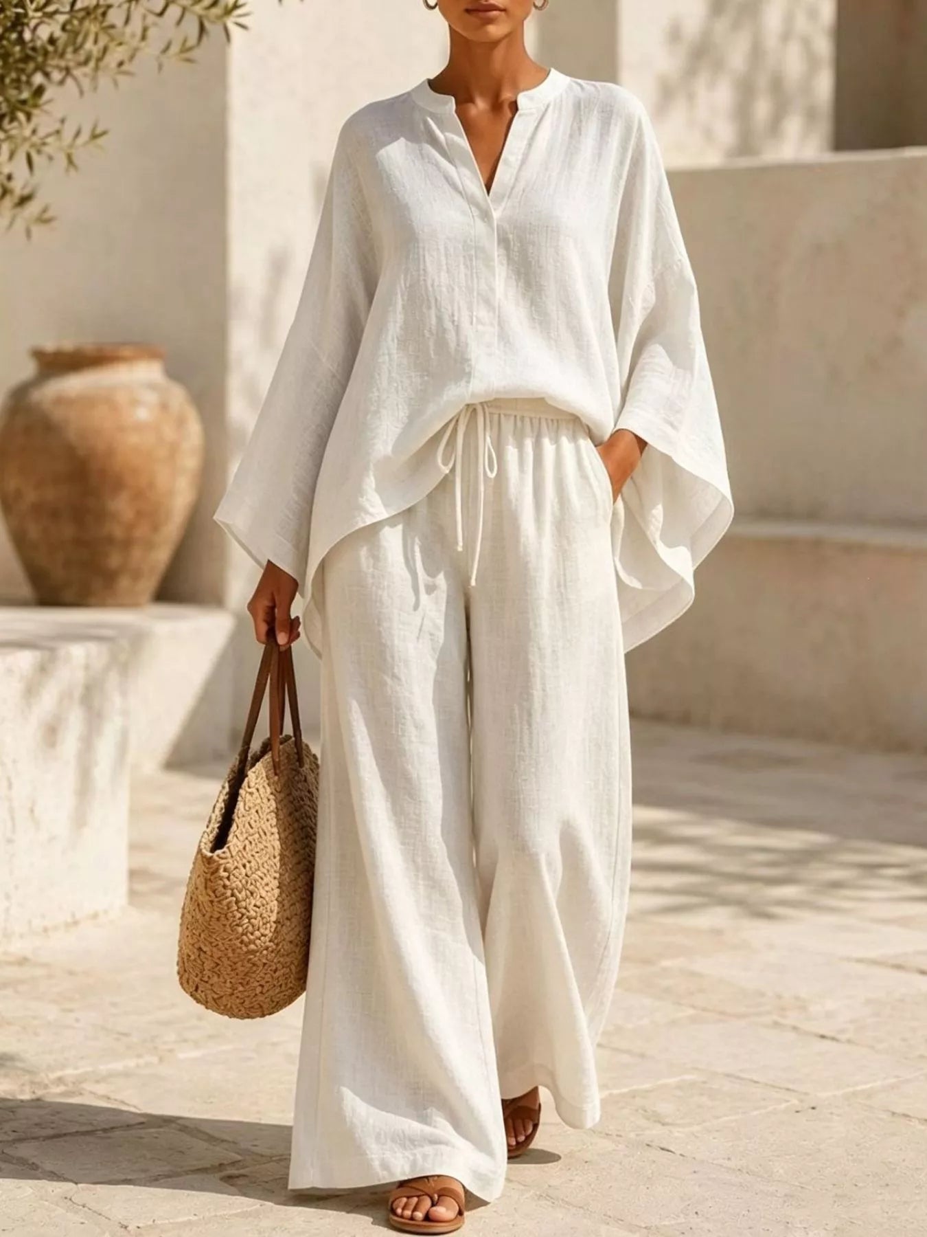Plus size Trendsi loungewear set with a full size notched long sleeve top and wide-leg pants, laid out on a neutral background.