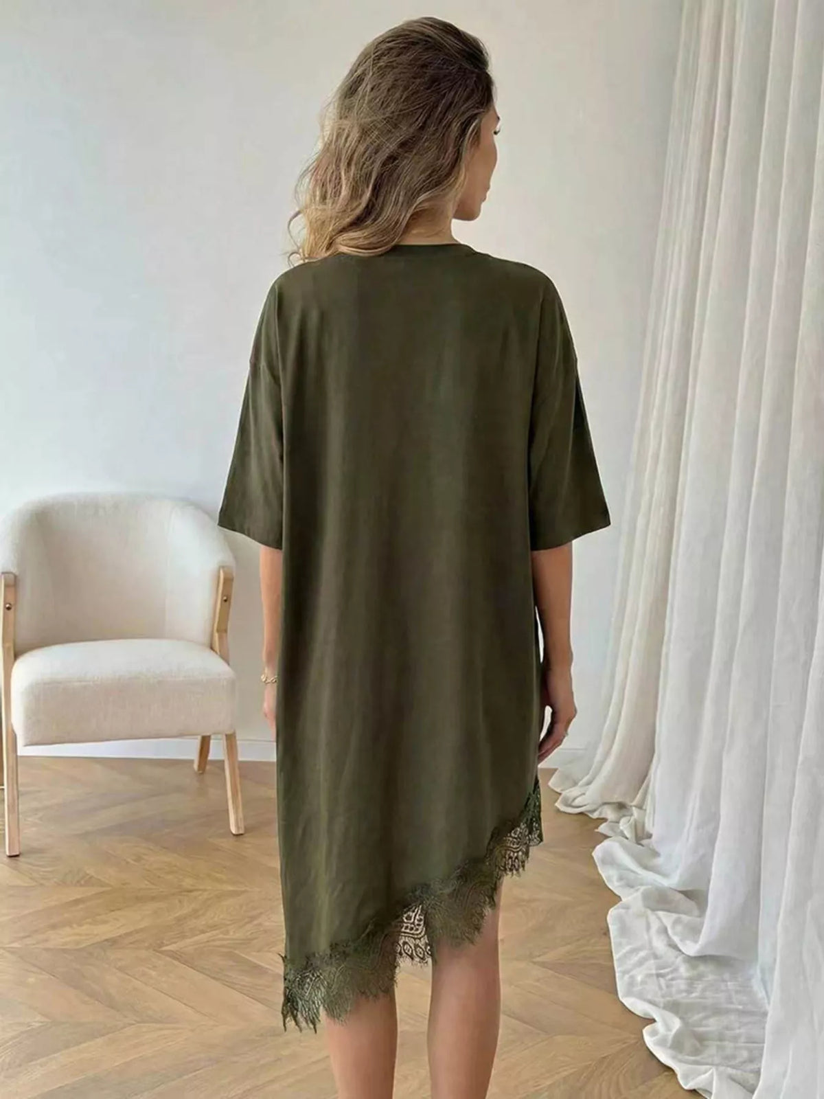 Lace trim asymmetrical hem T-shirt dress by Plush Fashion Hub, featuring a casual shirt dress design with lace details and a unique hem.