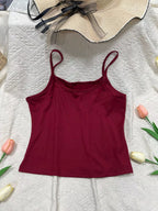 Solid color scoop neck camisole tank top from Plush Fashion Hub, featuring a sleeveless design and comfortable fit.