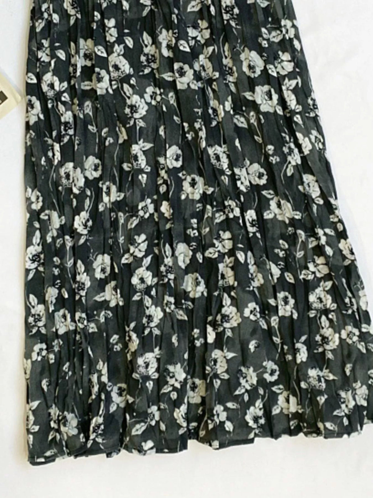 Floral print elastic waist midi skirt from Plush Fashion Hub, featuring a flowy design with vibrant flower patterns.
