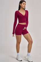 Fitglutes Activewear long sleeve crop top, stylish gymwear with fitted design and comfortable fabric for workout or casual wear.