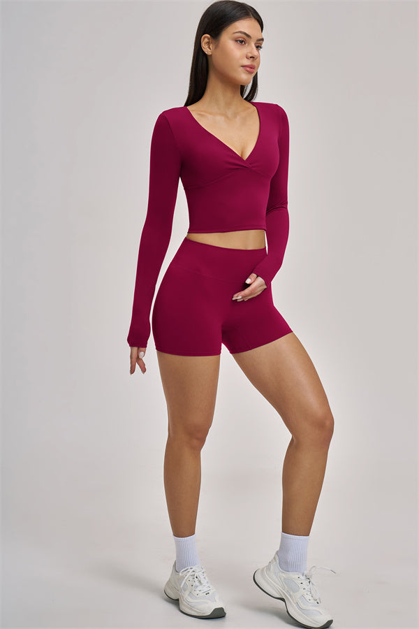 Fitglutes Activewear long sleeve crop top, stylish gymwear with fitted design and comfortable fabric for workout or casual wear.