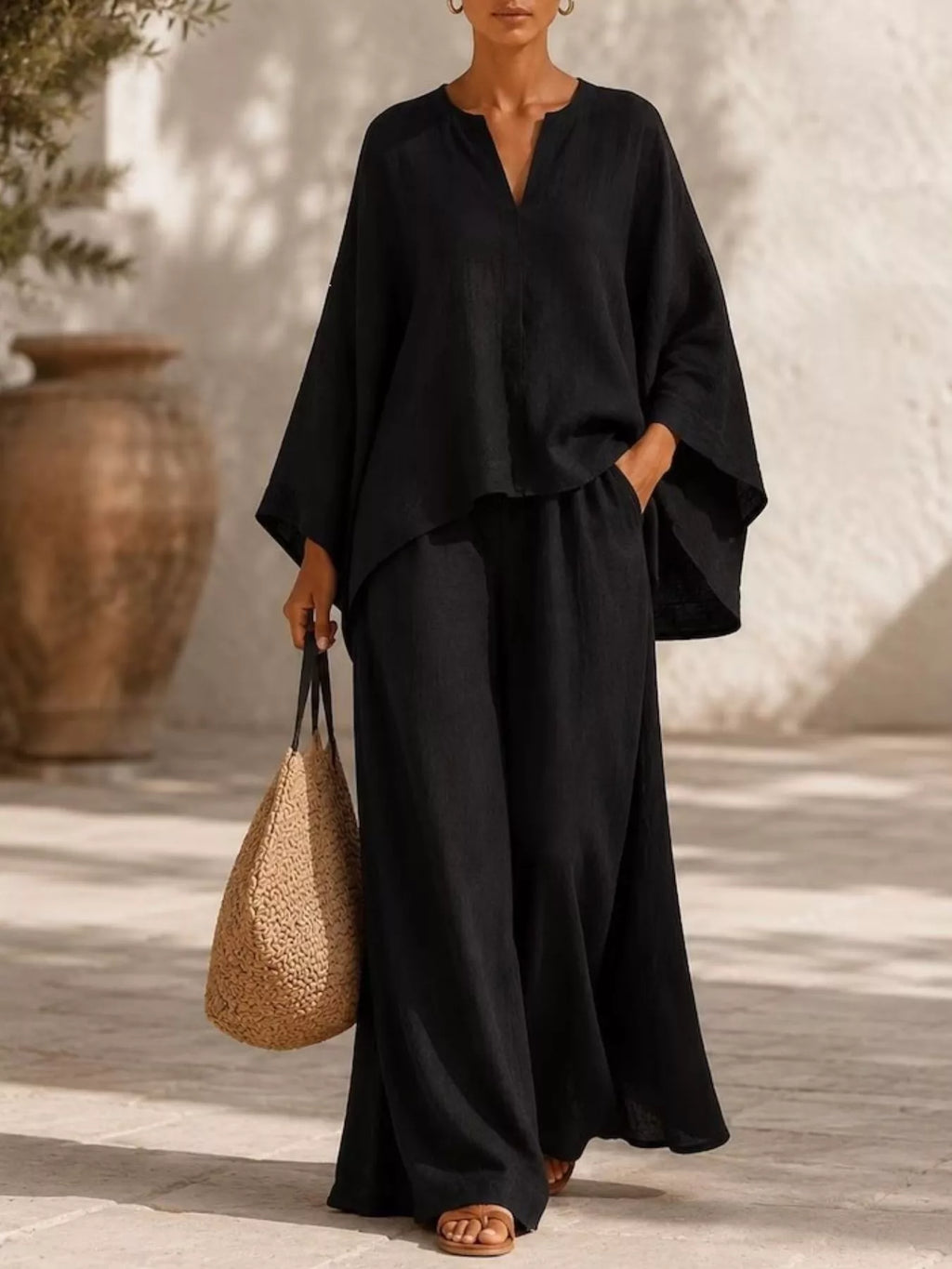 Plus size loungewear set featuring a notched long sleeve top and wide-leg pants, stylish and comfortable for relaxed wear.