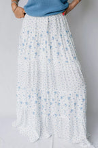 Women's high waisted floral boho maxi skirt with flowy tiered viscose fabric, featuring a relaxed, bohemian style.