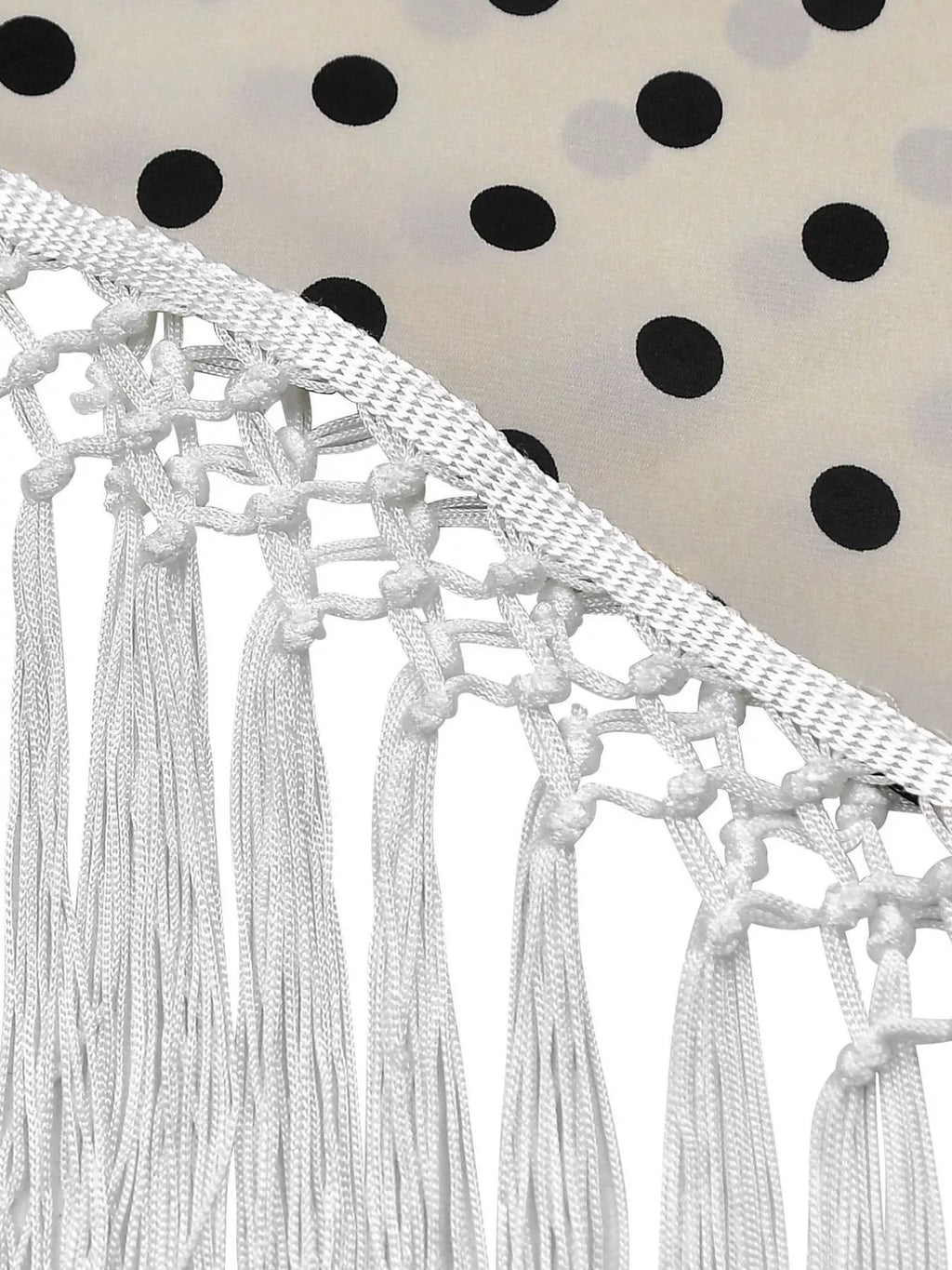Polka dot halter neck cami and fringe trim pants set with rings detail, stylish fashion by Trendsi, shown on a model.