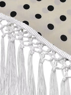 Polka dot halter neck cami and fringe trim pants set with rings detail, stylish fashion by Trendsi, shown on a model.