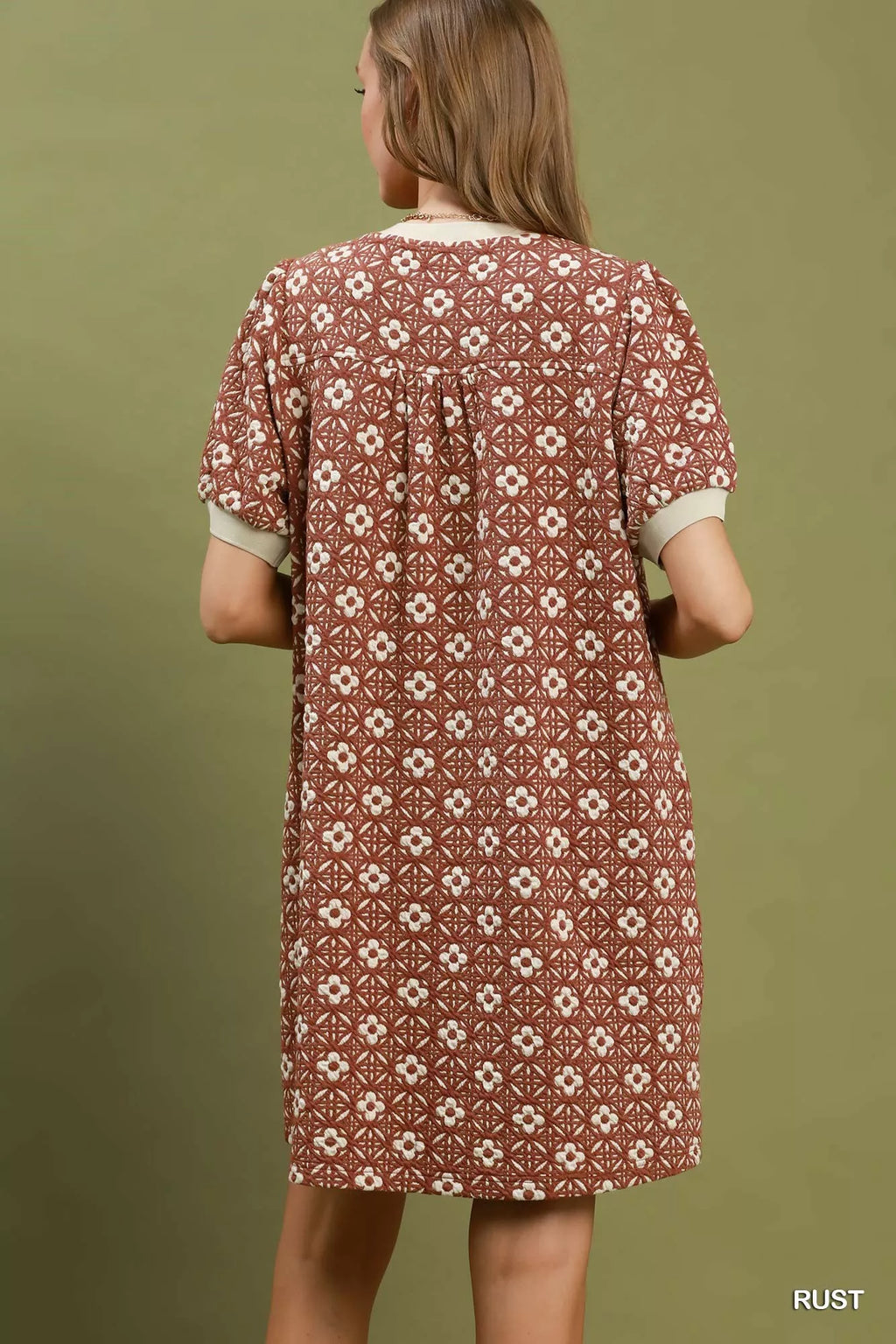 Umgee floral textured puff sleeve mini dress with a fitted bodice and lightweight fabric, styled for casual and summer wear.