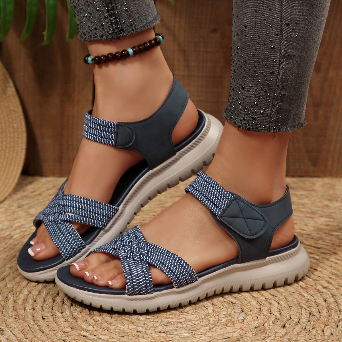Women's open toe woven strap flat sandals by Trendsi, featuring comfortable faux leather slides and casual summer style.