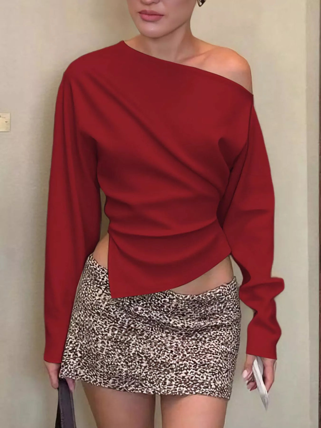 Asymmetrical off-shoulder long sleeve T-shirt by Shopimist, featuring a stylish, modern top with a unique neckline and fitted design.