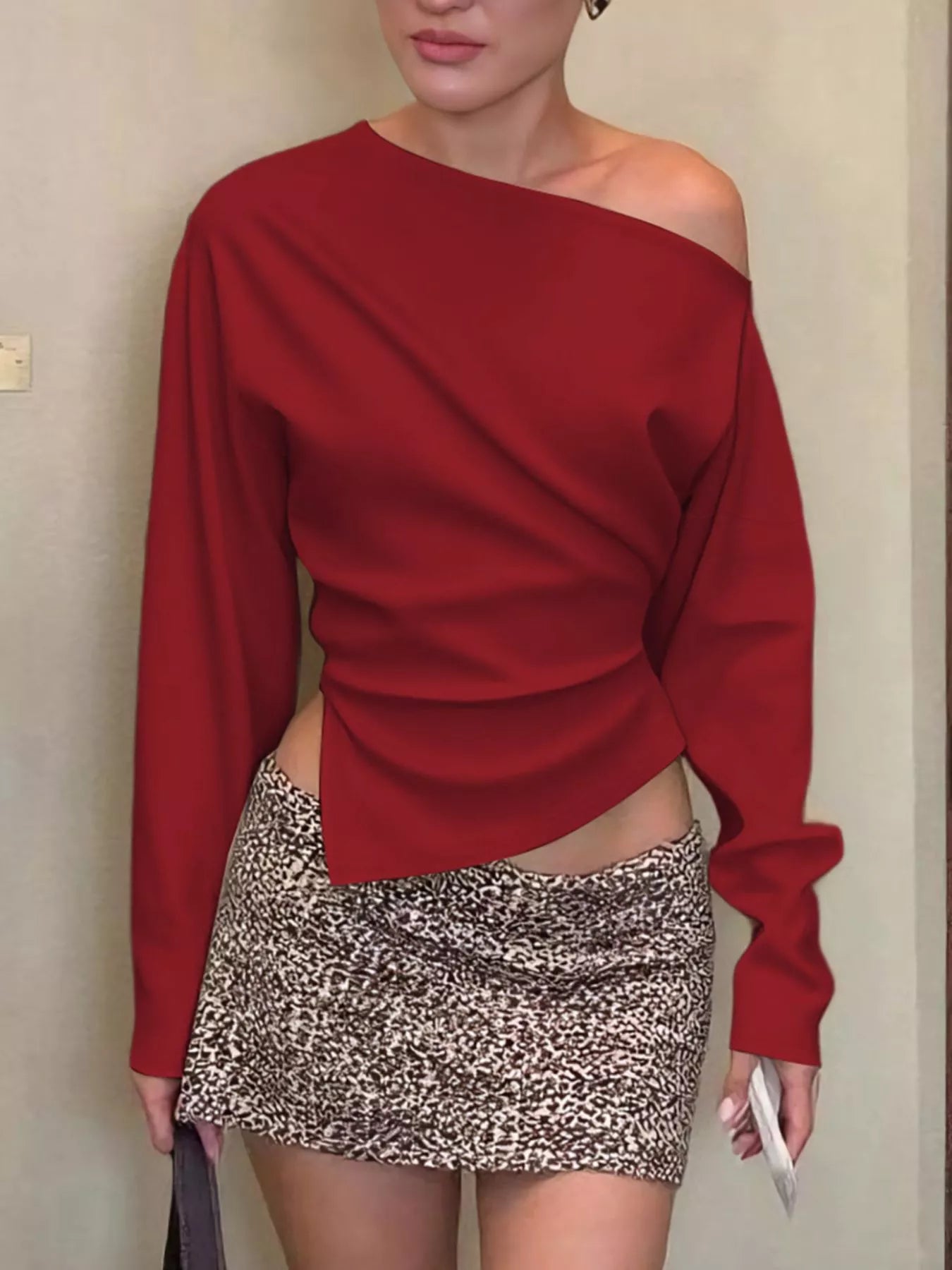 Asymmetrical off-shoulder long sleeve T-shirt by Shopimist, featuring a stylish, modern top with a unique neckline and fitted design.