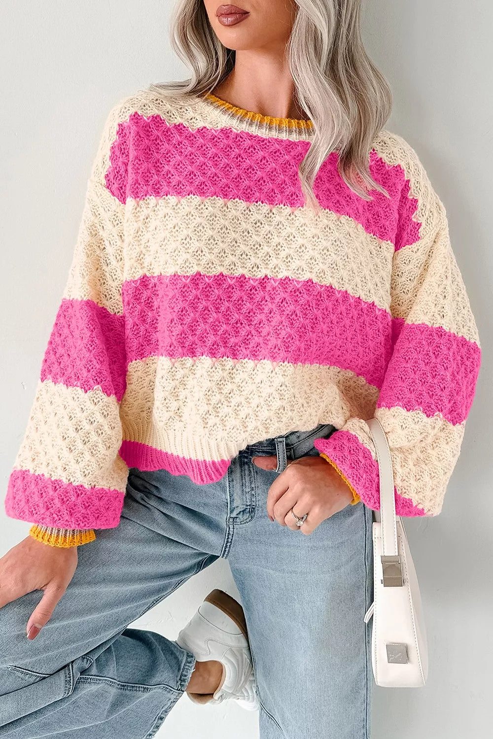 Women's striped colorblock textured drop shoulder sweater by Trendsi, featuring bold stripes and cozy knit fabric.