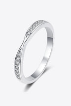 Rhodium-plated Moissanite ring with sparkling center stone and elegant band, showcasing fine craftsmanship and brilliance.