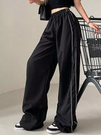 Lightweight women's high-rise wide-leg dress pants with elastic waist, stylish and comfortable for casual or office wear.
