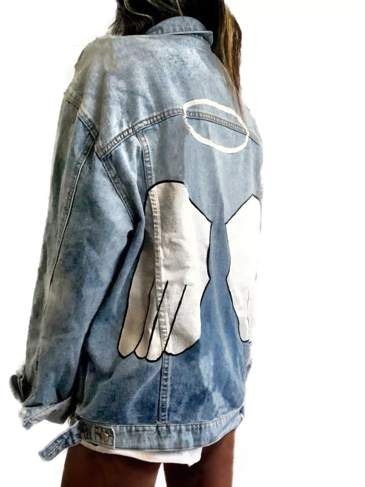 Plus size denim jacket with angel wings graphic back design, trendy full-size denim jacket by Trendsi, casual streetwear style.