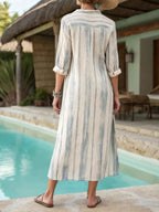 Classic striped button-down midi dress with pockets from Trendsi, featuring a relaxed fit and stylish design.