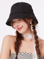 Women's lightweight textured summer bucket hat from Trendsi, breathable casual sun hat with a wide brim and relaxed fit.
