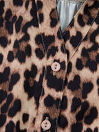 Leopard print short sleeve blouse with lace trim and button front from Plush Fashion Hub, styled on a mannequin.
