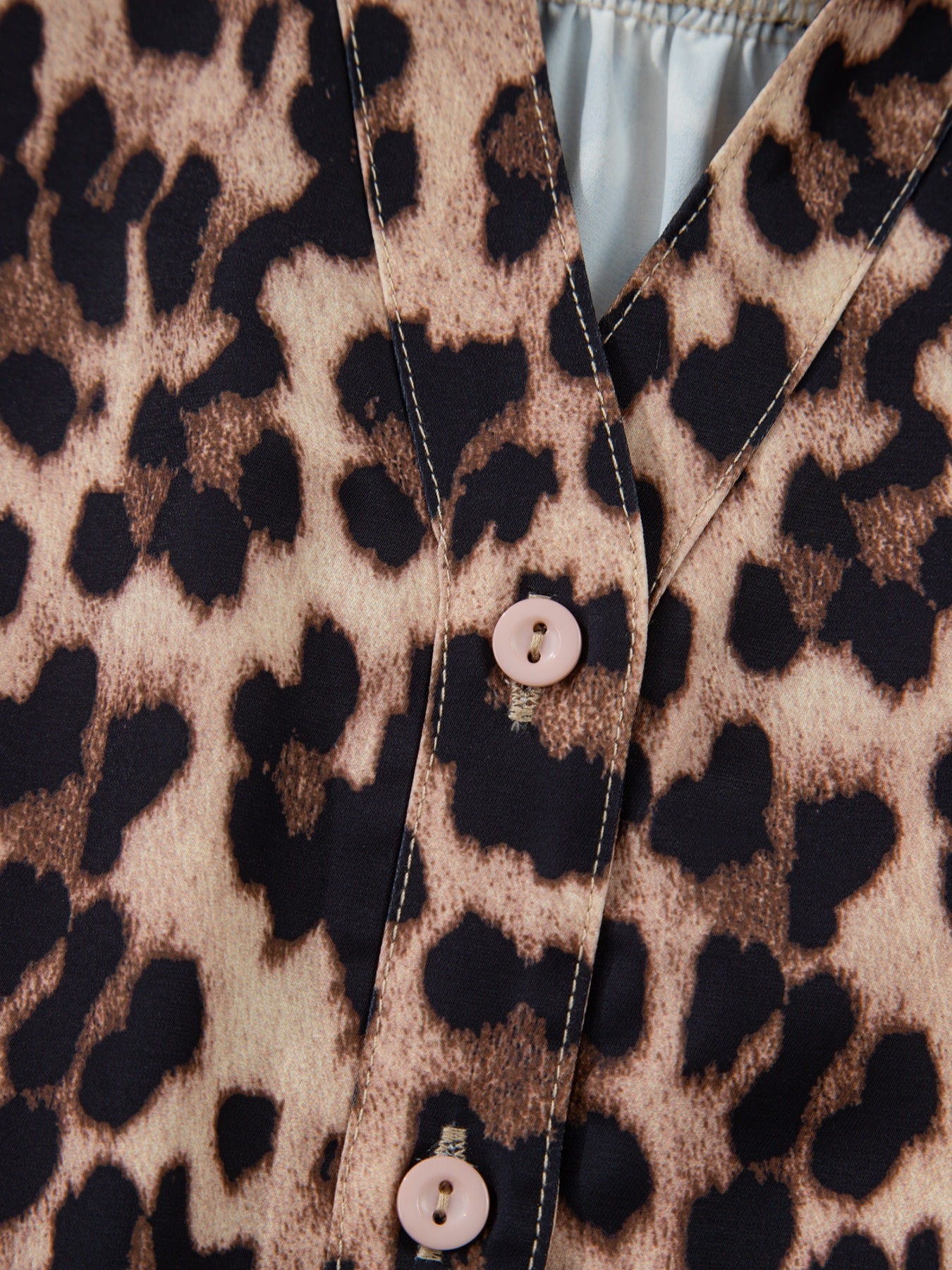 Leopard print short sleeve blouse with lace trim and button front from Plush Fashion Hub, styled on a mannequin.