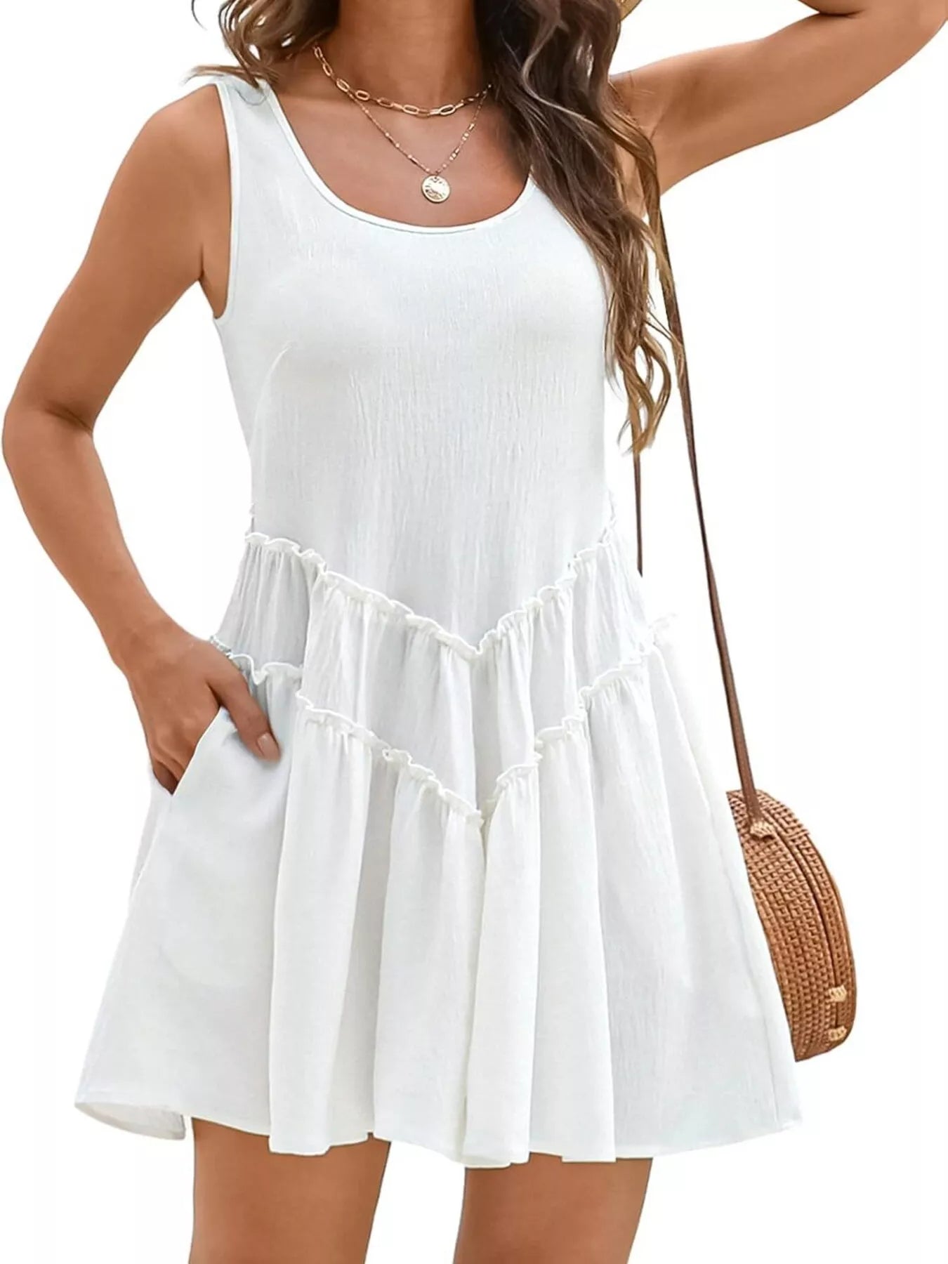 Women's sleeveless round neck mini dress with pockets, stylish and casual from Trendsi, shown on a model with a simple background.