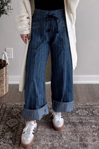 Striped wide-leg denim jeans from Plush Fashion Shop, featuring a relaxed fit and stylish vertical stripe pattern.