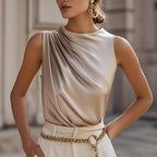 Women's elegant sleeveless mock neck top by FitiqueFit, shown in a casualwear style, featuring a sleek mock neck and sleeveless design.