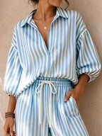 Plus size striped puff sleeve shirt and wide-leg drawstring pants set by Trendsi, featuring comfortable fabric and stylish design.