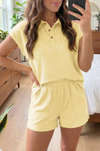 Solid color polo tee and elastic waist shorts lounge set by Trendsi, casual and comfortable for relaxed wear.