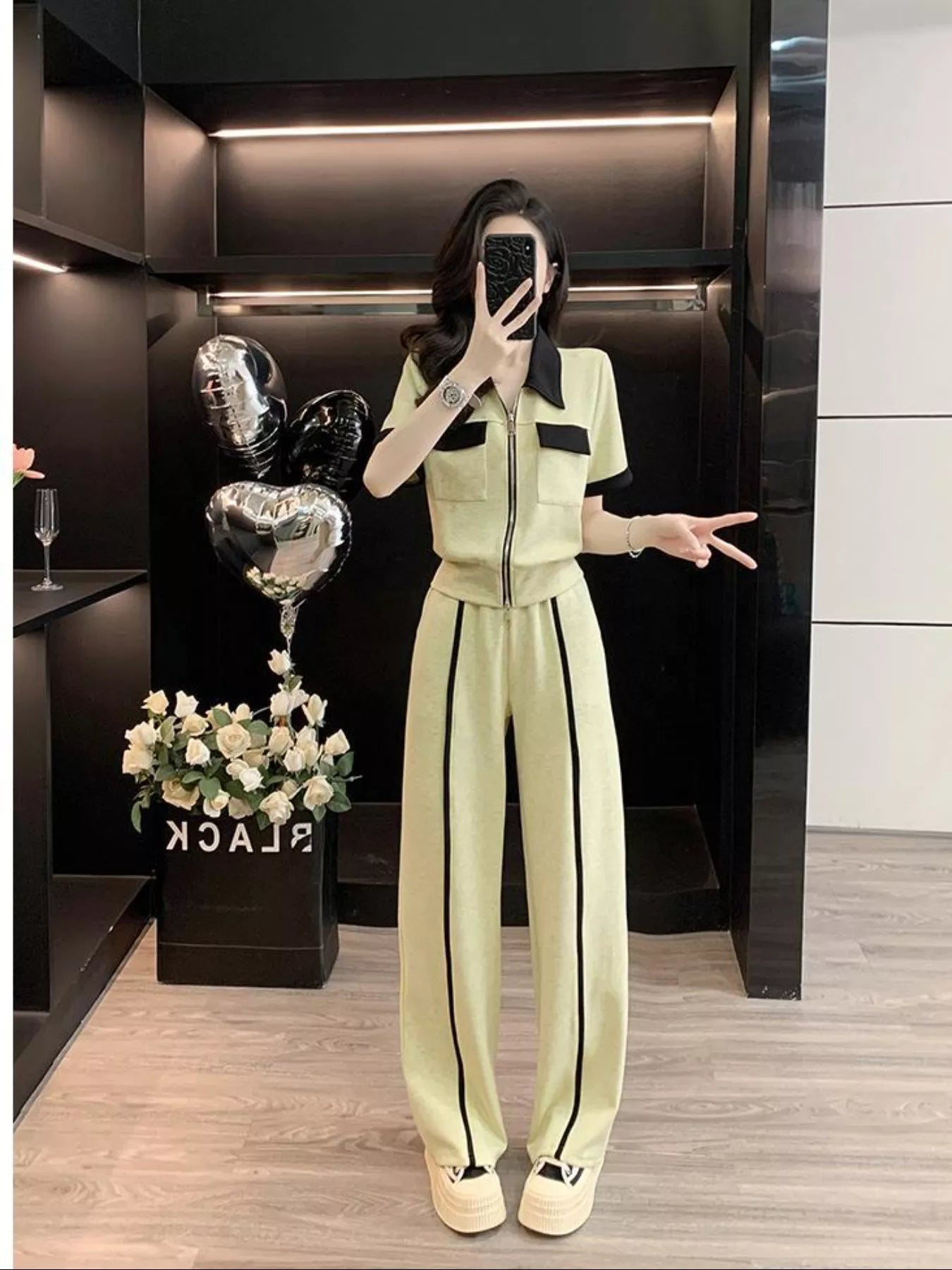 Contrast zip-up top and wide-leg pants set from Plush Fashion Hub, stylish two-piece outfit with bold color blocking.