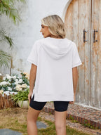 Half zip short sleeve hooded top from Trendsi, featuring a lightweight fabric and casual style with a front zipper and hood.