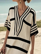 Plus size women's striped half-sleeve midi dress by Plush Fashion Hub, casual chic everyday wear, shown on model.