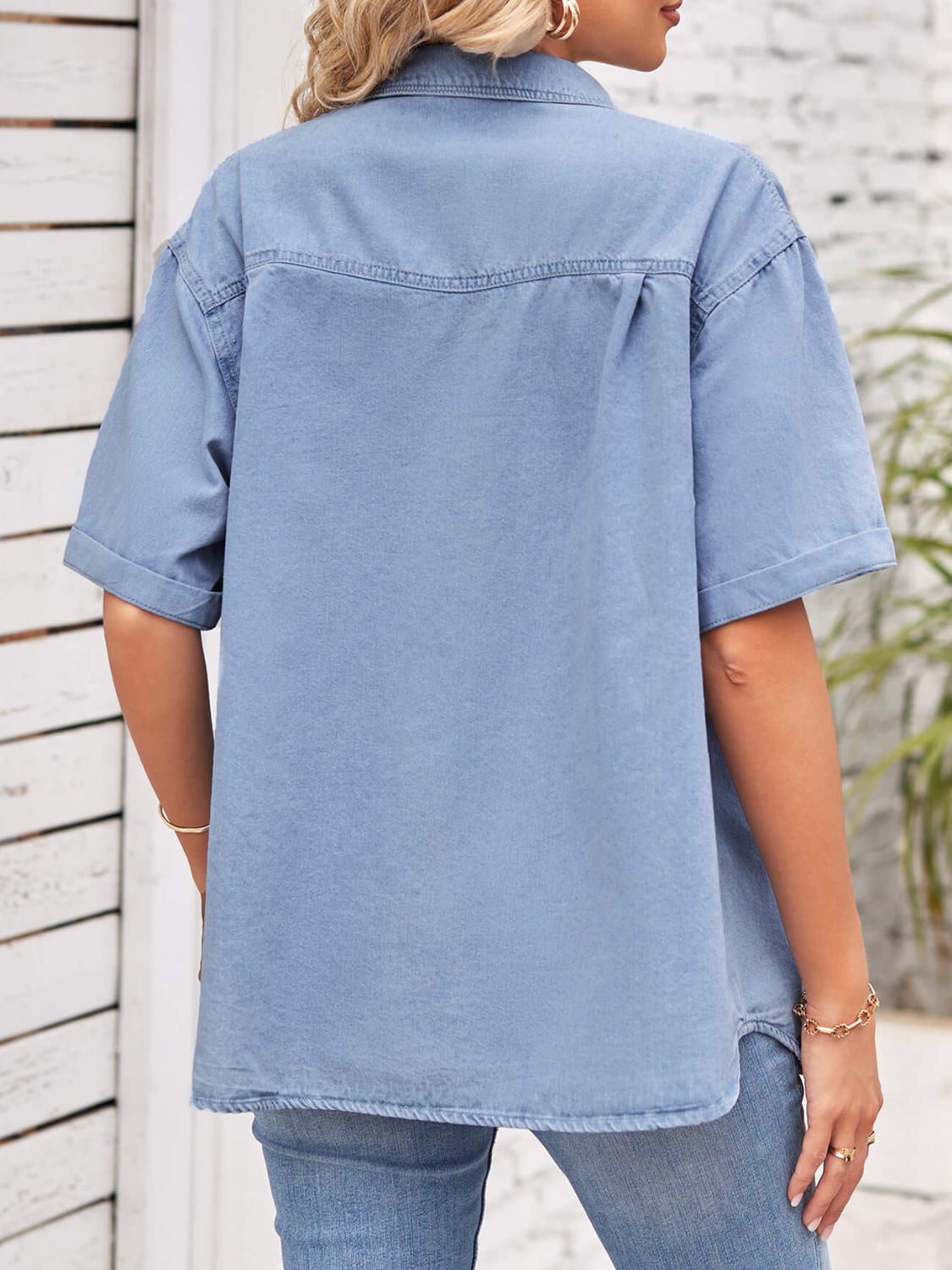 Blue denim short sleeve collared jacket by Plush Fashion Hub, casual shirt with button closure and chest pockets.