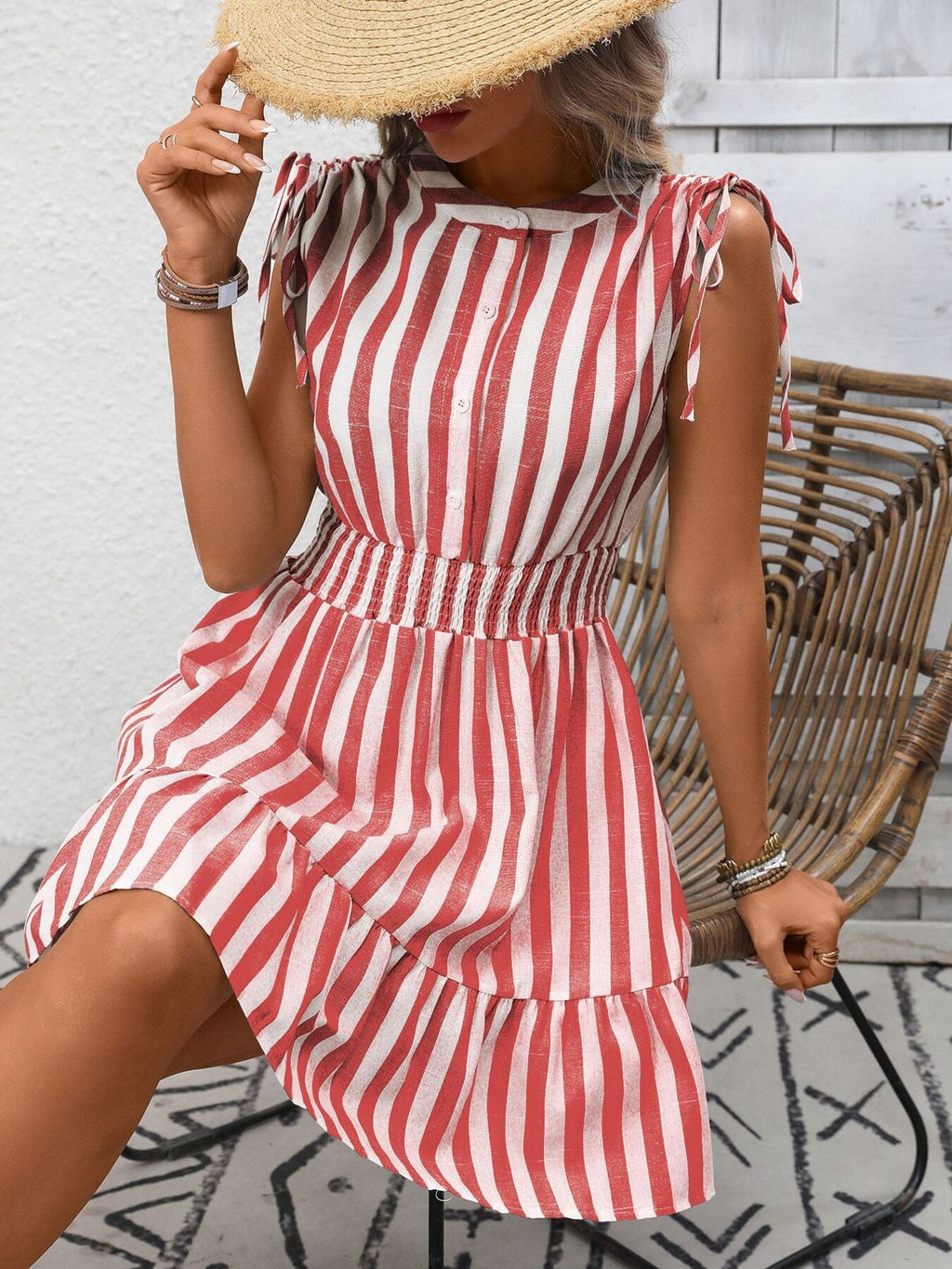 Women's striped smocked summer dress with ruffle hem by Trendsi, featuring a fitted bodice and breezy, stylish design.