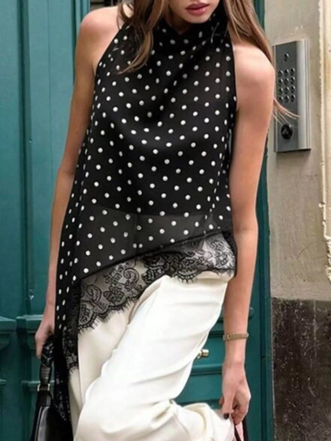 Polka dot lace trim sleeveless blouse with asymmetrical hem from Plush Fashion Hub, featuring a stylish and feminine design.