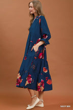 Umgee floral print tiered midi dress with puff sleeves, featuring a feminine and flowy design, perfect for spring and summer wear.