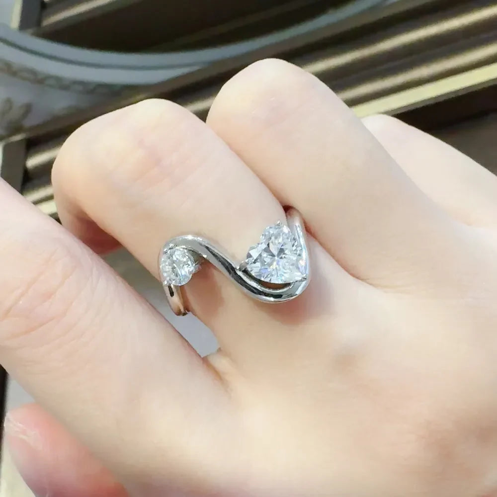 Sterling silver ring with 1.3 carat irregular-shaped moissanite gemstone, stylish jewelry accessory.