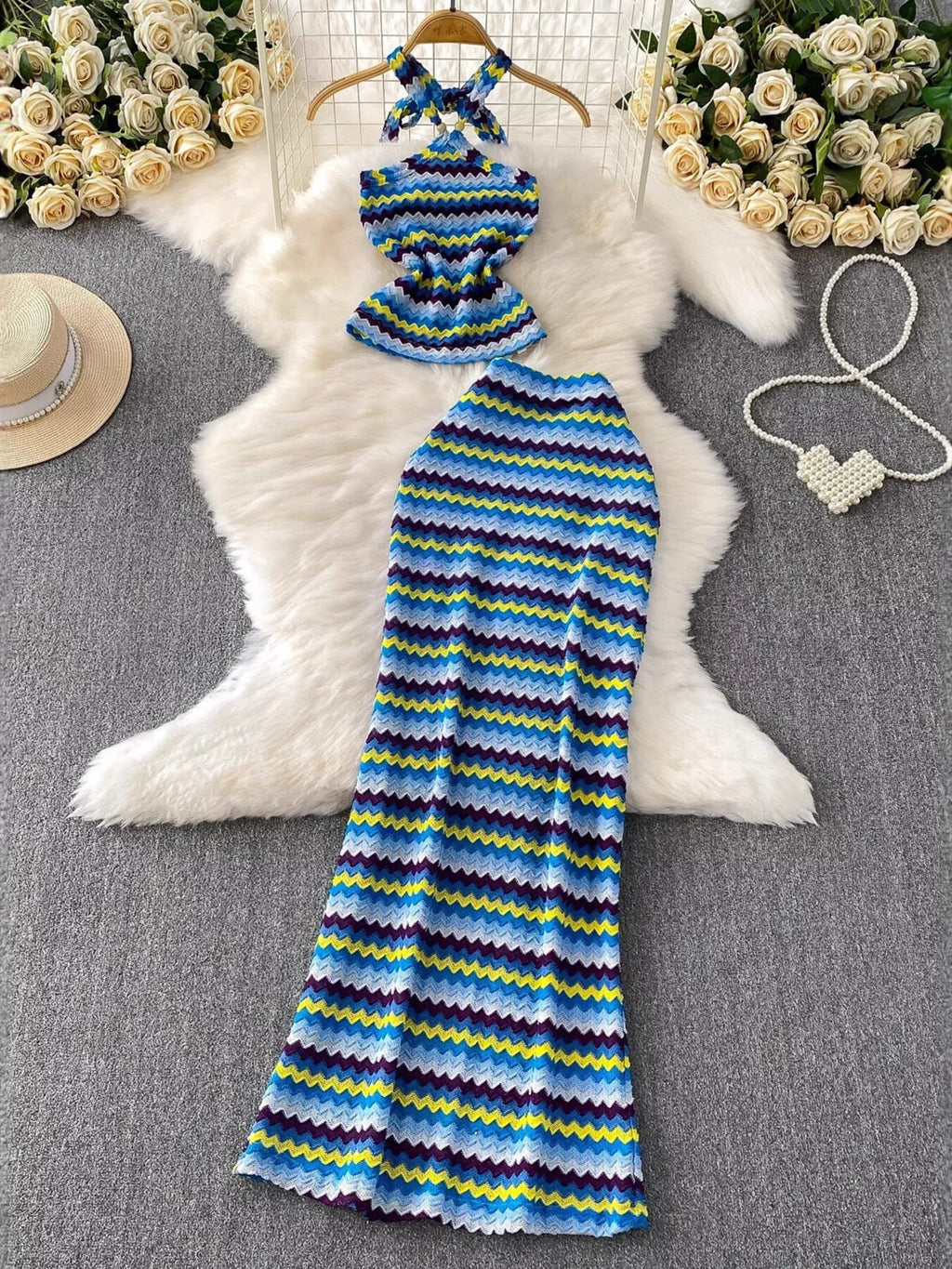 Women's striped knitted halter top and maxi skirt set, casual dress by Trendsi, featuring a stylish halter neckline and flowing skirt.