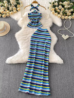 Women's striped knitted halter top and maxi skirt set, casual dress by Trendsi, featuring a stylish halter neckline and flowing skirt.