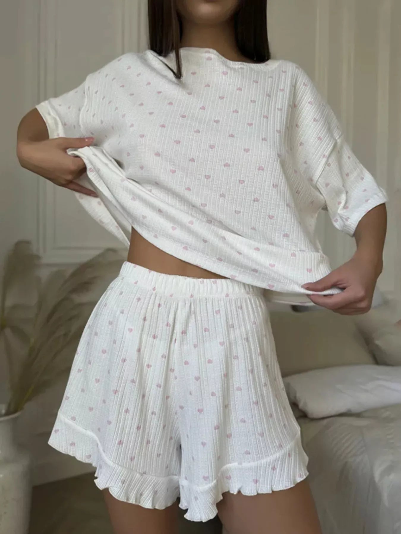Heart print casual lounge set by Plush Fashion Hub, featuring a relaxed top and matching shorts in a comfortable two-piece design.
