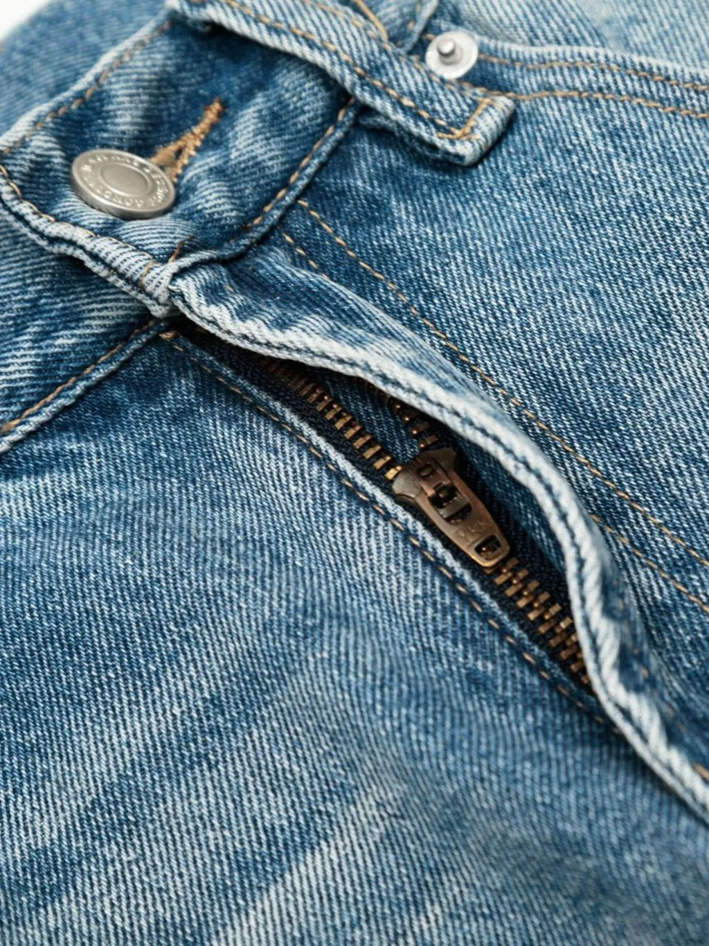 Men's loose fit jeans by Trendsi, showing a relaxed fit design with classic denim fabric and stitching details.
