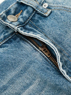 Men's loose fit jeans by Trendsi, showing a relaxed fit design with classic denim fabric and stitching details.