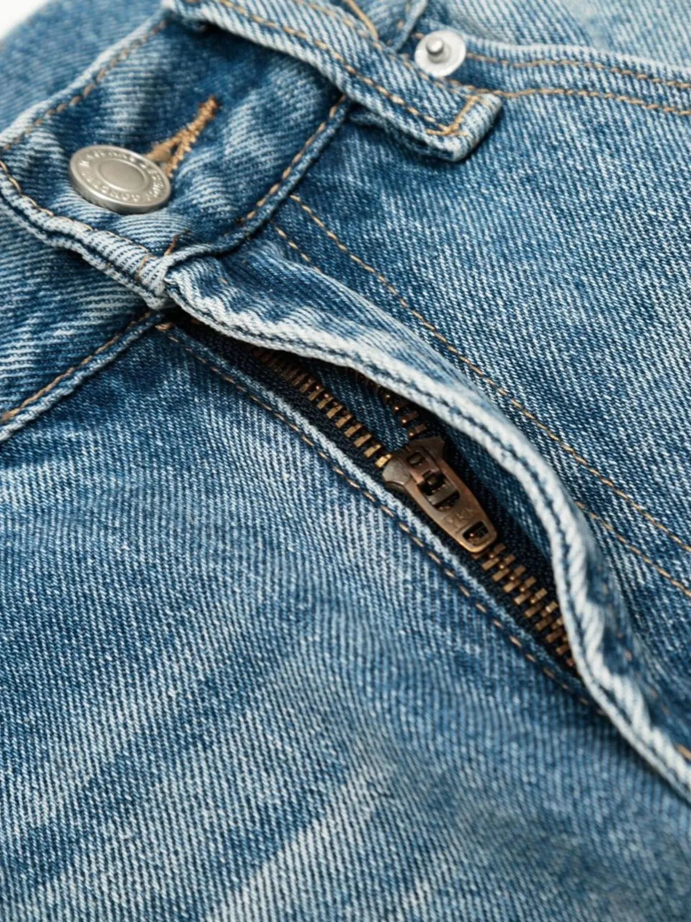 Men's loose fit jeans by Trendsi, showing a relaxed fit design with classic denim fabric and stitching details.