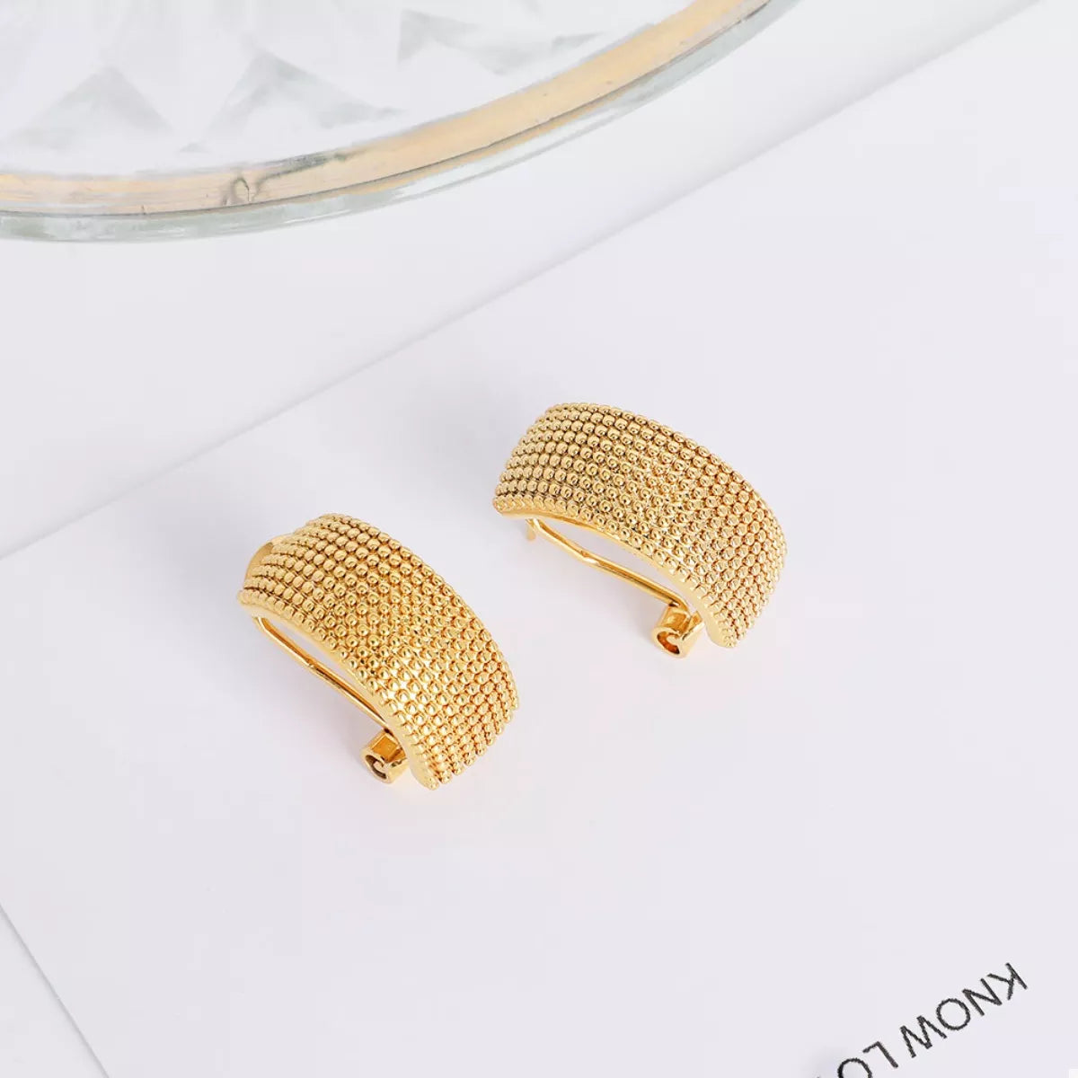 Gold-plated textured wide band hoop earrings from Plush Fashion Hub, showcasing a bold, stylish design with a polished finish.