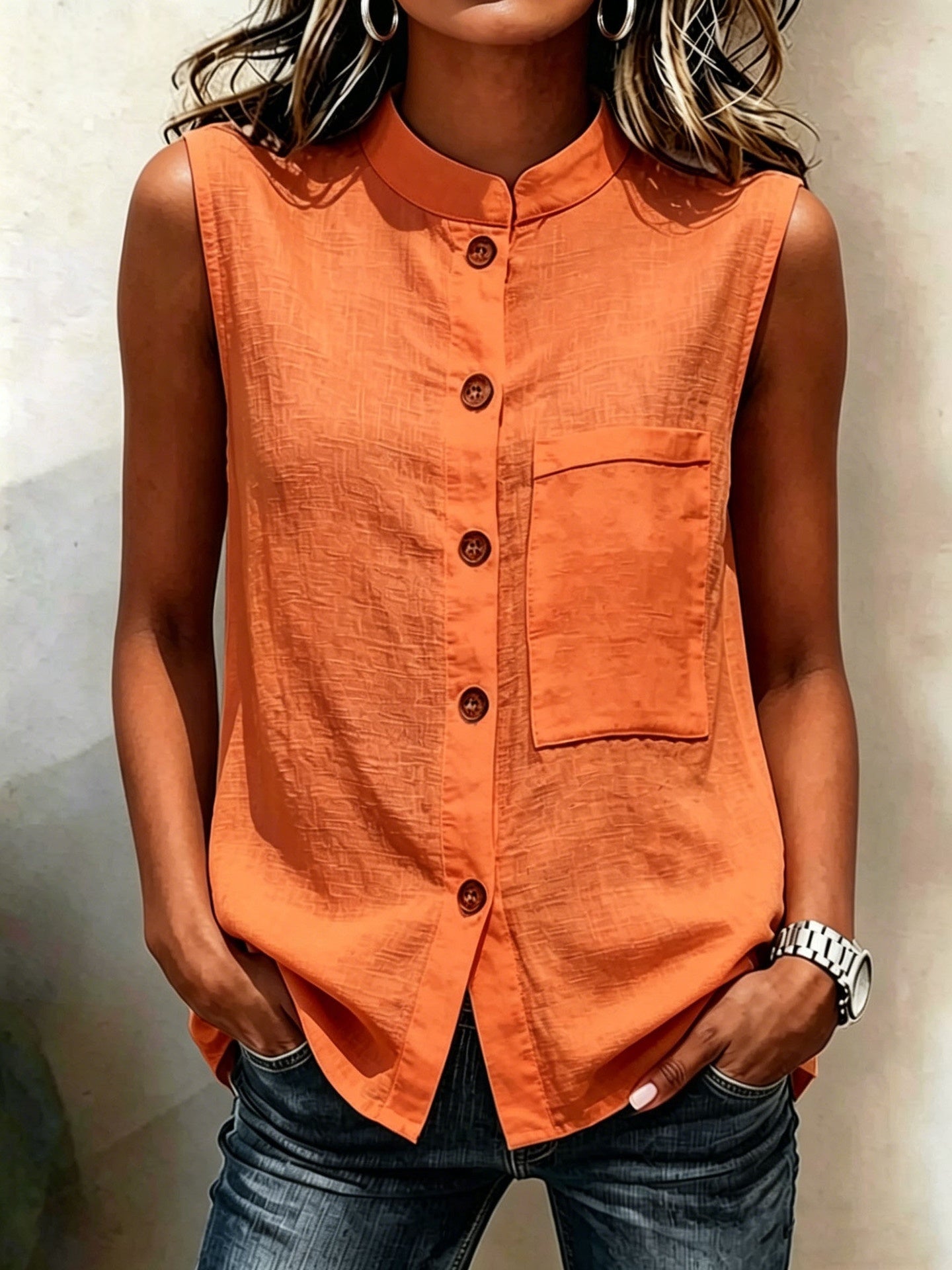 Women's sleeveless crop top with buttoned pockets in solid color, casualwear by FitiqueFit, shown in water background.