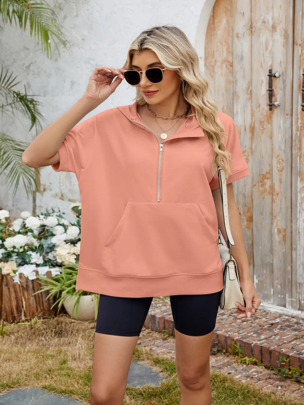 Light gray half zip short sleeve hooded top from Trendsi, featuring a comfortable fit and casual style.