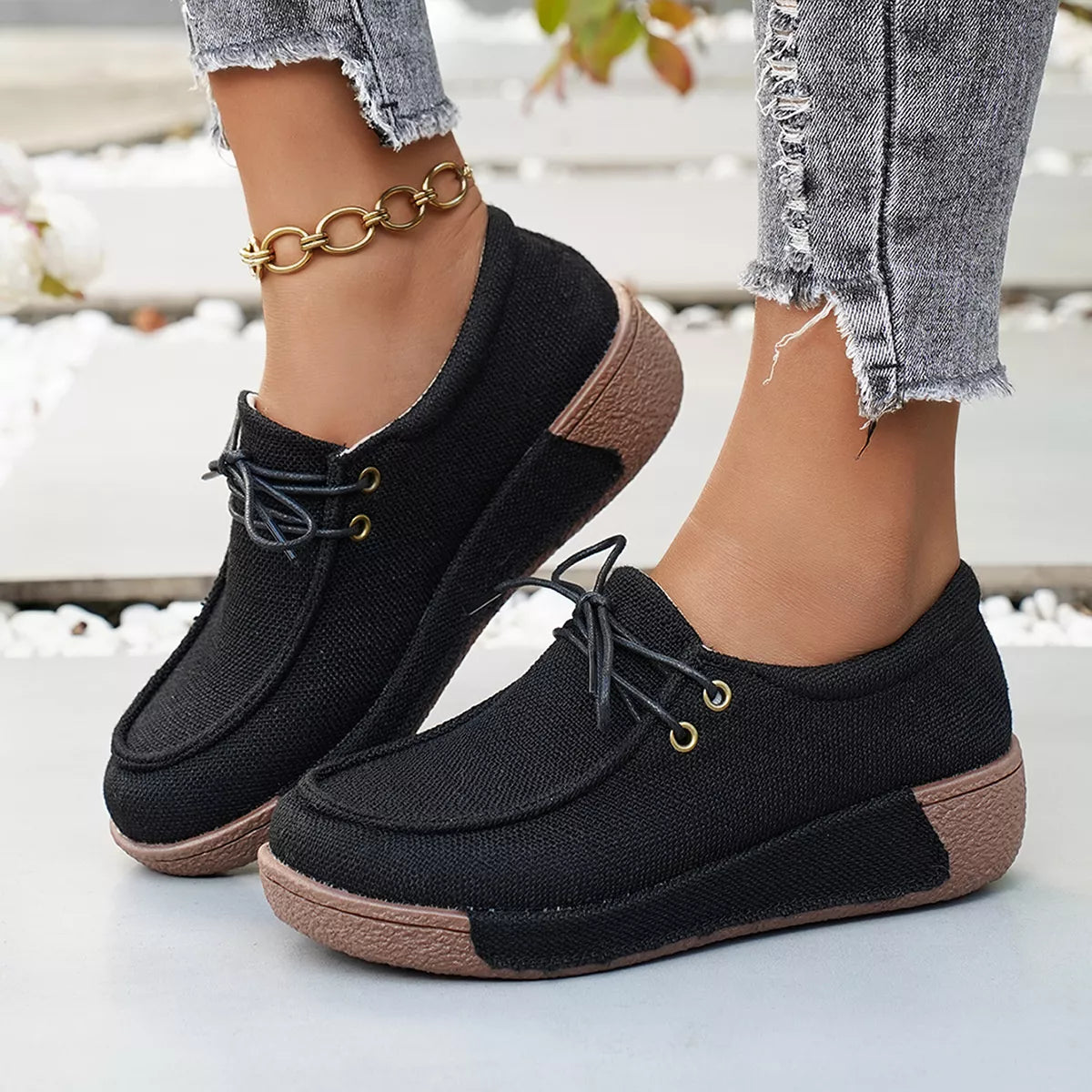 Round toe lace-up sneakers by Trendsi, stylish footwear with a classic design, featuring white laces and a comfortable rubber sole.