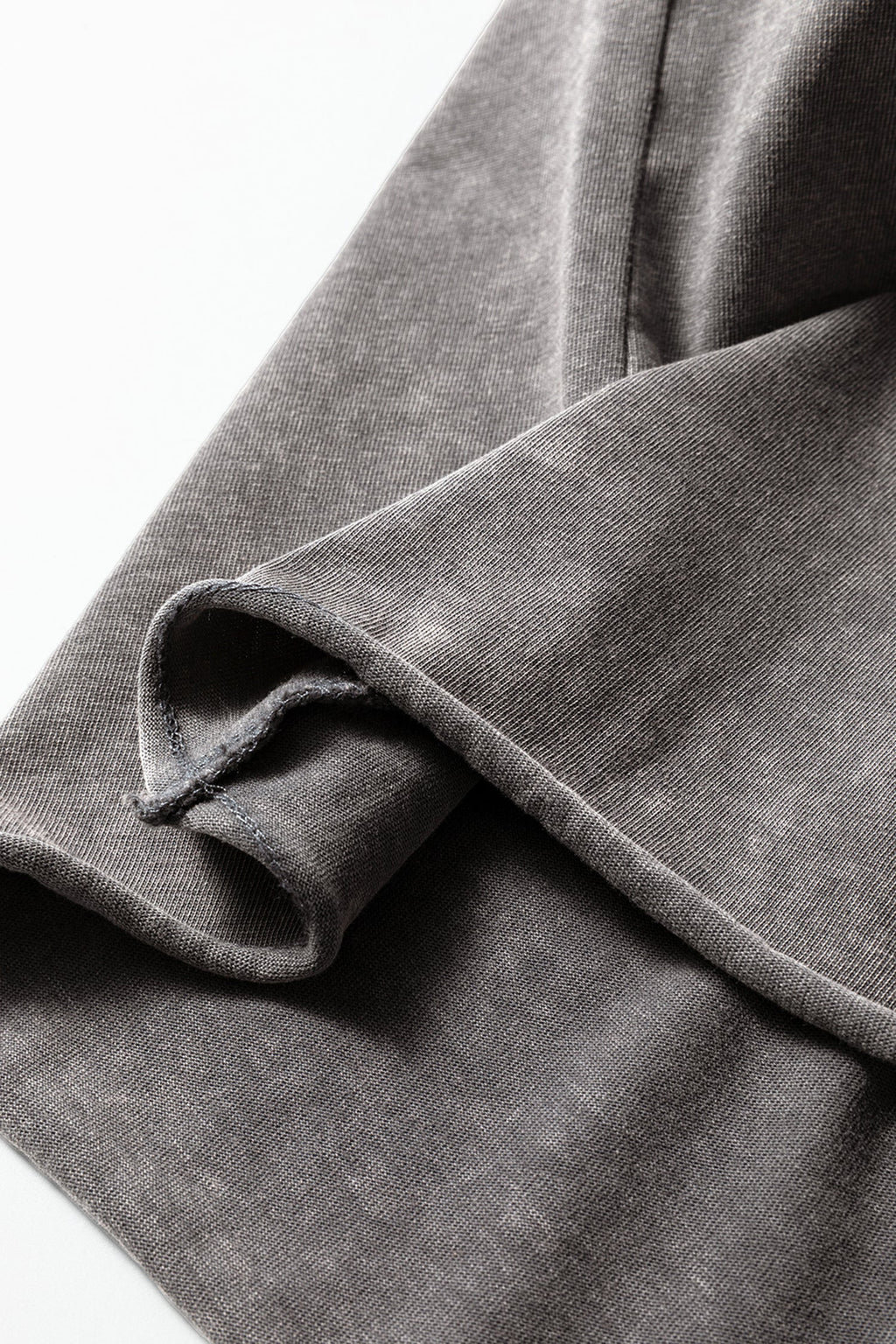 Light gray Ellianna Fit Cotton Tank Top by Threaded Pear, showing a close-up of the soft, breathable fabric and sleeveless design.