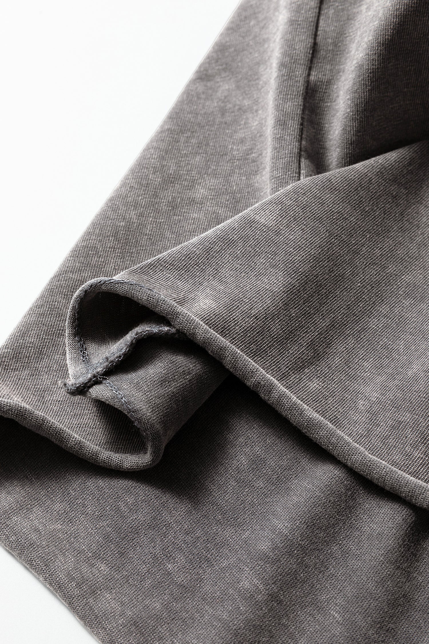 Light gray Ellianna Fit Cotton Tank Top by Threaded Pear, showing a close-up of the soft, breathable fabric and sleeveless design.