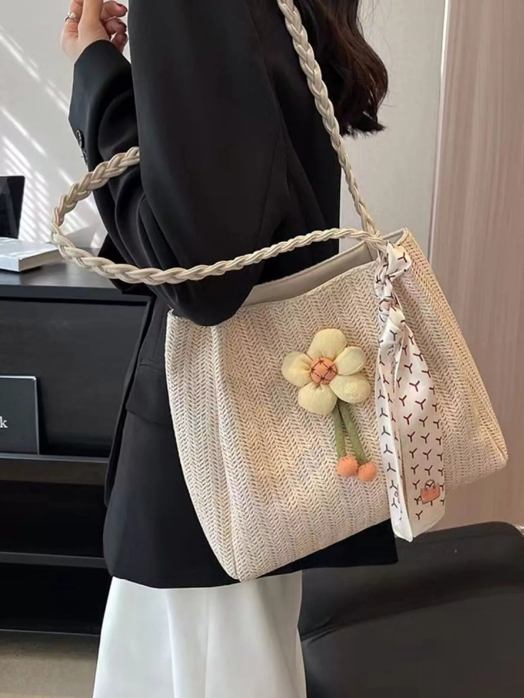 Woven straw tote bag with floral decor details, lightweight and spacious, perfect for casual outings and summer accessories.