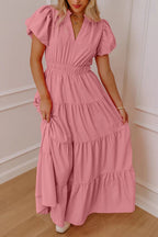 Women's floral maxi dress with ruffled tiers and puff sleeves by Plush Fashion Hub, featuring an elegant long design.